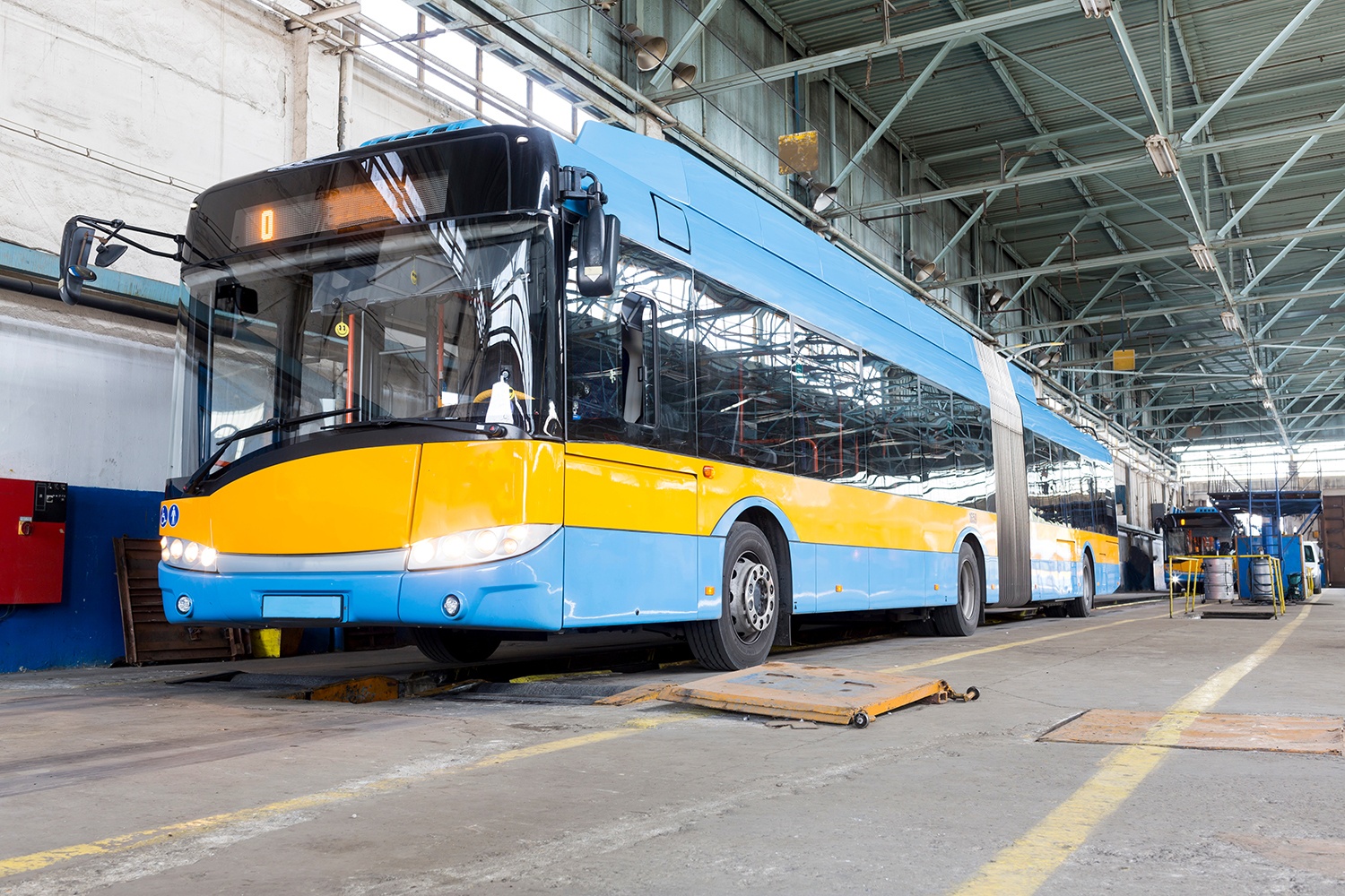 A bus parked at a maintenance depot